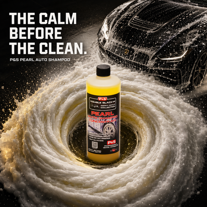 A bottle of P&S Pearl Auto Shampoo stands in the center of a swirling foam ring, with a car covered in soap and water splashes in the background. Large text on the left reads, 'THE CALM BEFORE THE CLEAN.
